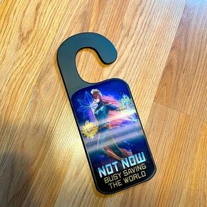 Captain Marvel door sign, says not now, busy, saving the world or welcome.
